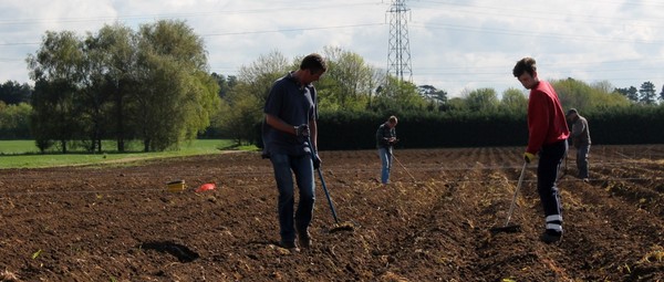 David raking potatoes